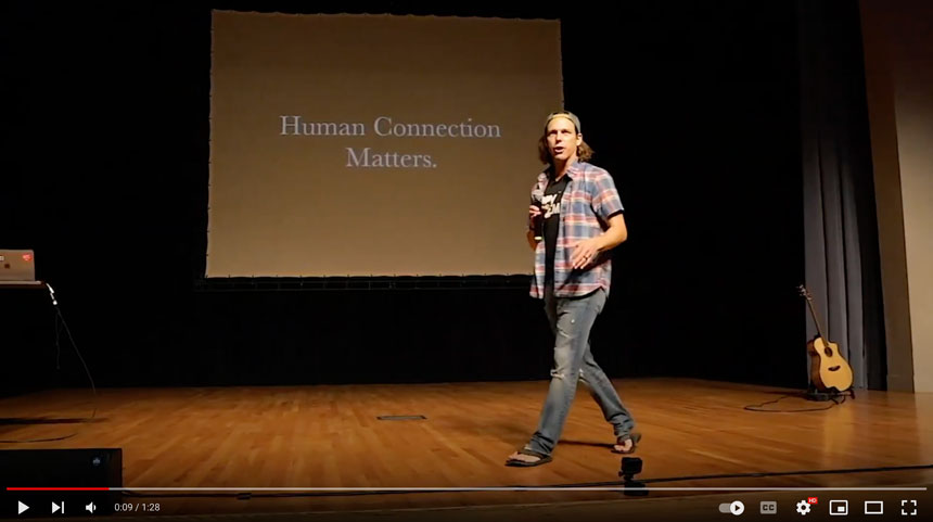 image of a man walking on stage