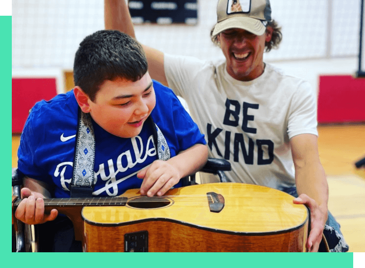 TILL360_joe-and-student-playing-guitar